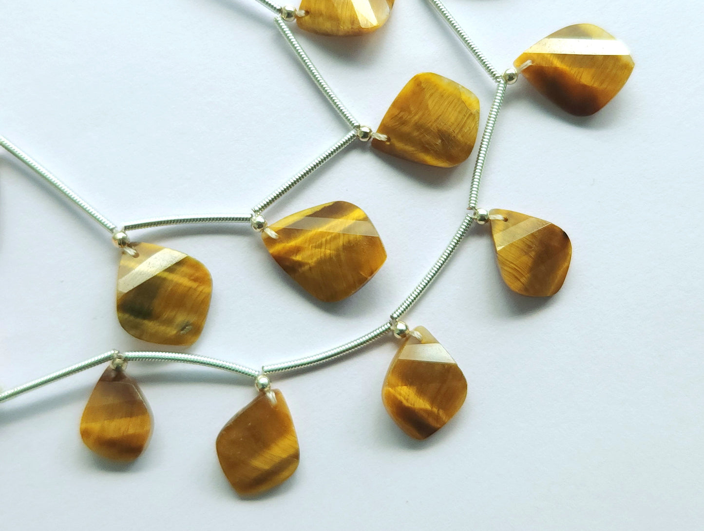 Natural Tiger Eye Faceted Briolette Twisted Pear Shape Gemstone Beads