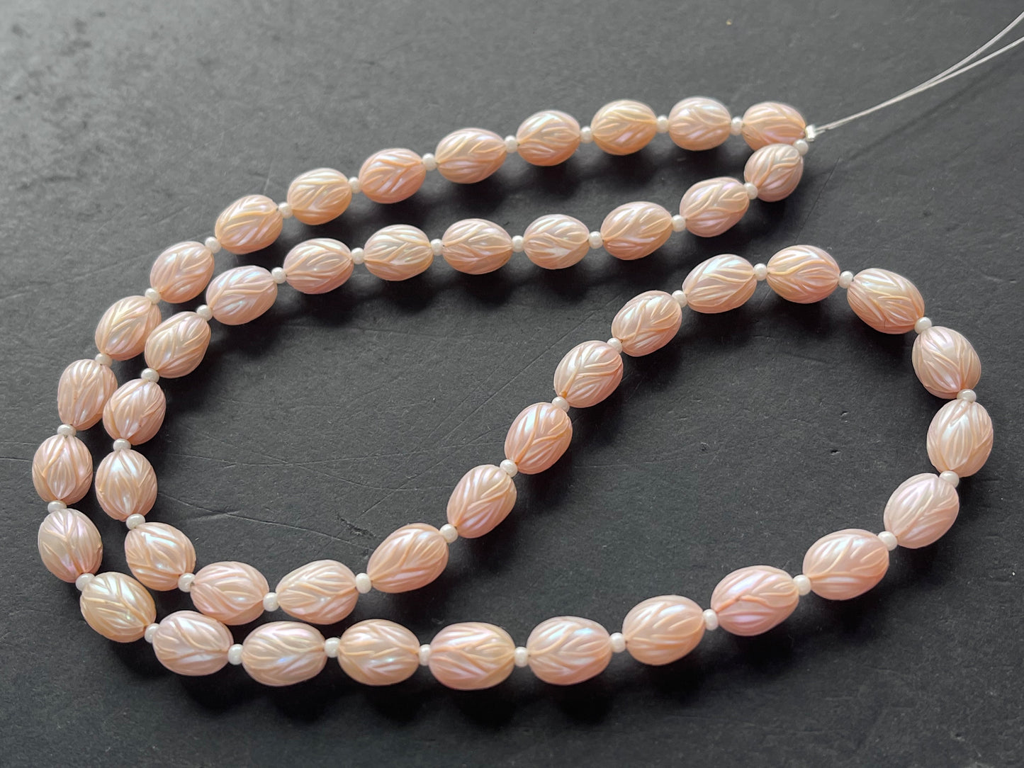 Pink Natural Freshwater Pearl Oval shape Hand-Carved Strand
